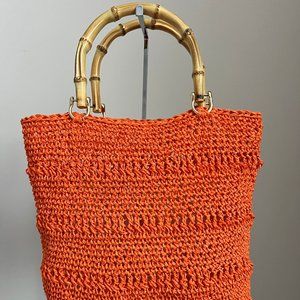 A Handcrafted Crocheted Purse with Bamboo Accents